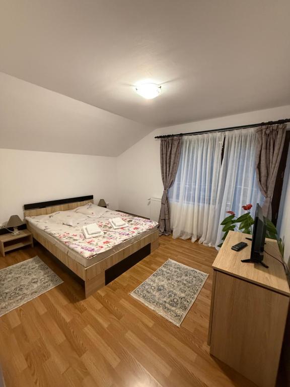 Postel nebo postele na pokoji v ubytování Vila Liniștea serii