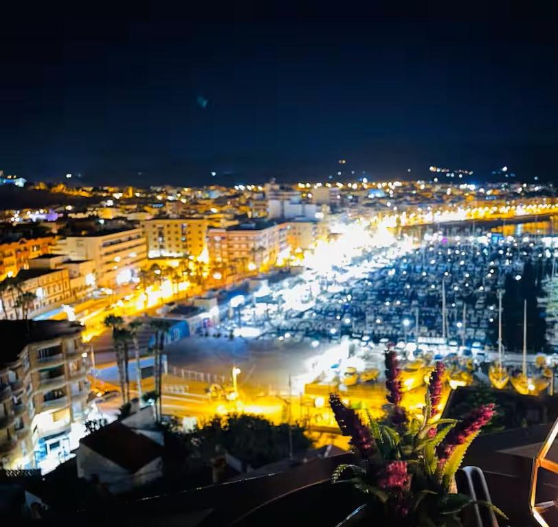 a view of a city at night with lights at Apartamento con vistas a toda la bahia in Puerto de Mazarrón