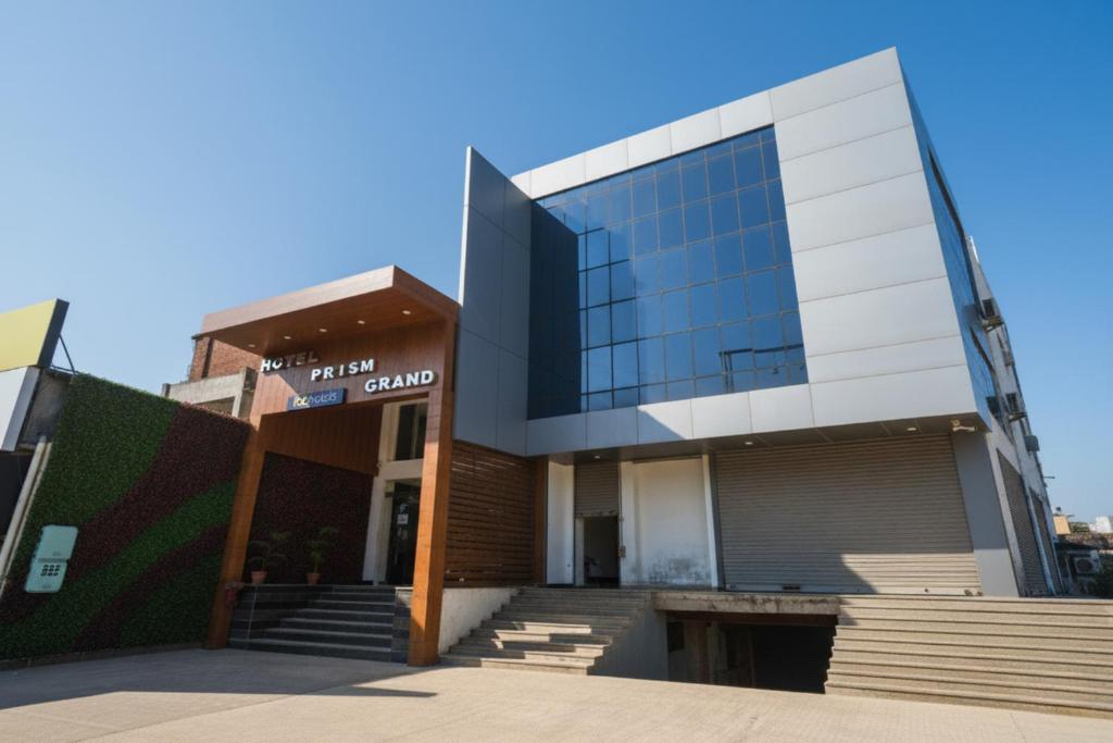 a large building with stairs in front of it at FabHotel Prism Grand - Nr Zirakpur Bus Stand' in Zirakpur