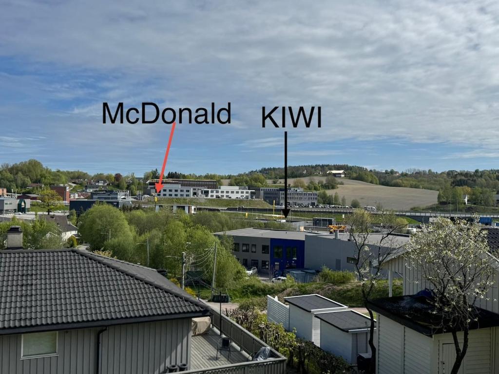 a view of a city with the words mcdaniel kiew at Modern apartment in Drammen