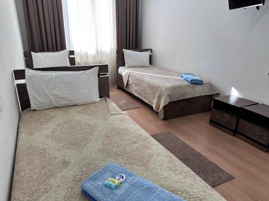 Postel nebo postele na pokoji v ubytování A-Hotel Ex Magistral