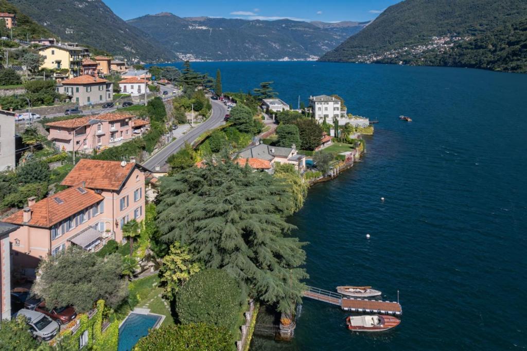 an aerial view of a town next to a body of water at Luxury Villa at Como Lake in Carate Urio