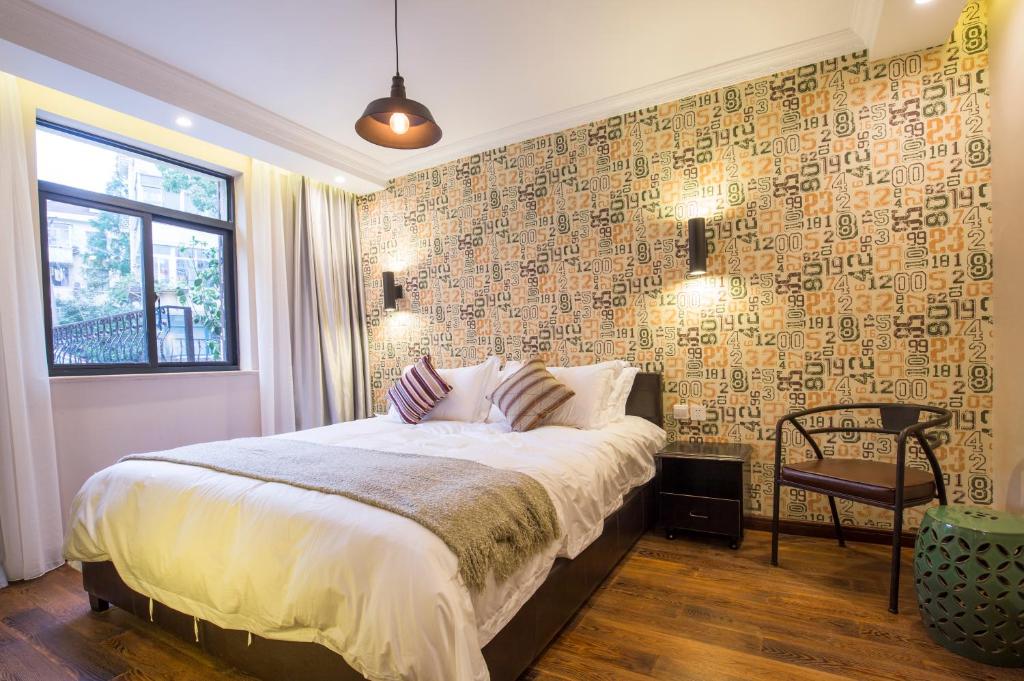 Voodi või voodid majutusasutuse Shanghai Soho Garden Hotel toas