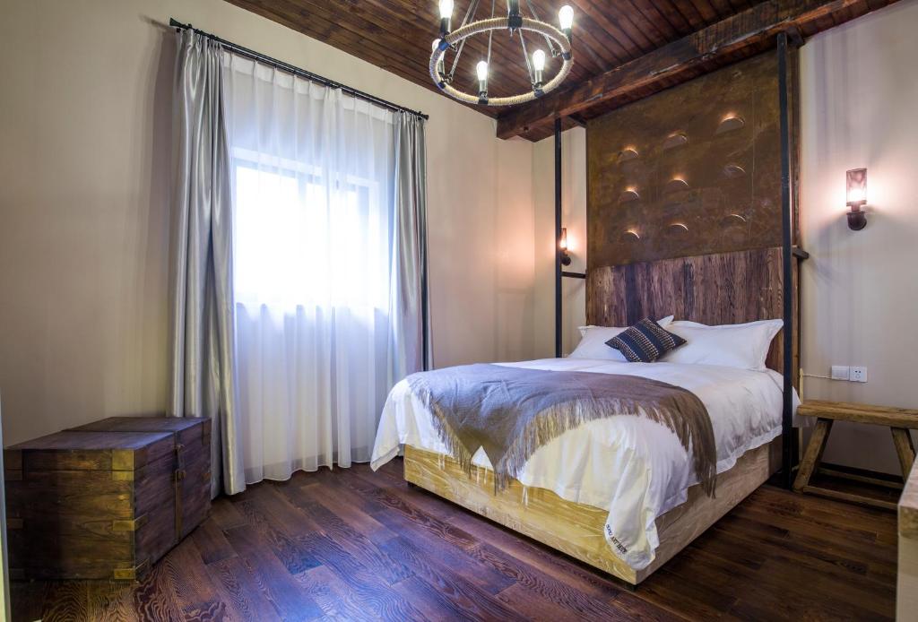Voodi või voodid majutusasutuse Shanghai Soho Garden Hotel toas
