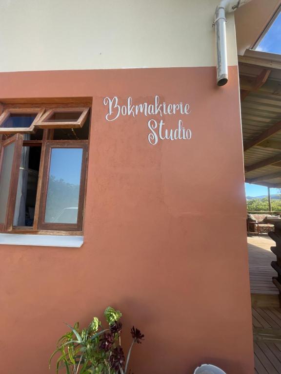 a sign on the side of a building at Bokmakierie Studio in Montagu