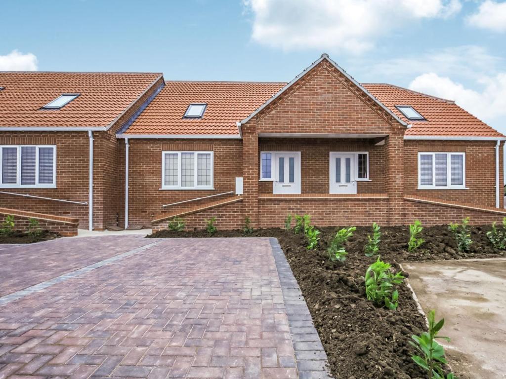 a house with a brick driveway in front of it at 2 Dawson Court - Uk33411 in Mablethorpe