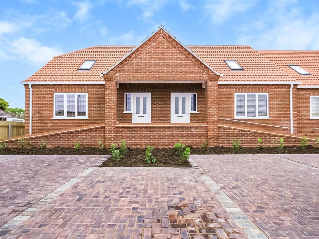 a brick house with a brick driveway at 4 Dawson Court - Uk33414 in Mablethorpe