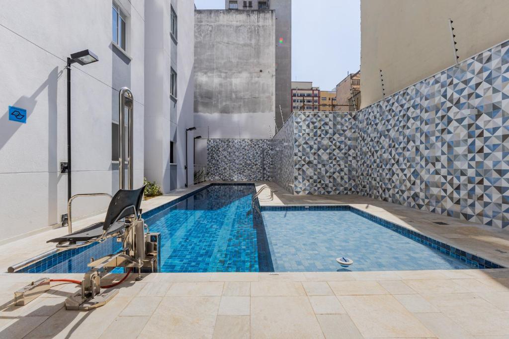 PROMOÇĀO - Apartamento Gamer com Cinema e Garagem Grátis游泳池或附近泳池