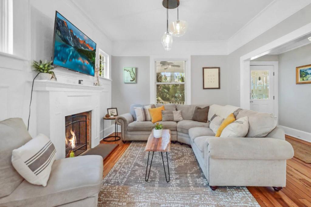 a living room with a couch and a fireplace at SaraCasa - First Floor House 2Br/1.5Bath in St. Augustine