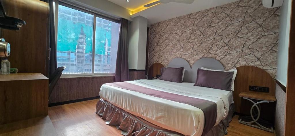 Postel nebo postele na pokoji v ubytování HOTEL KONARK in