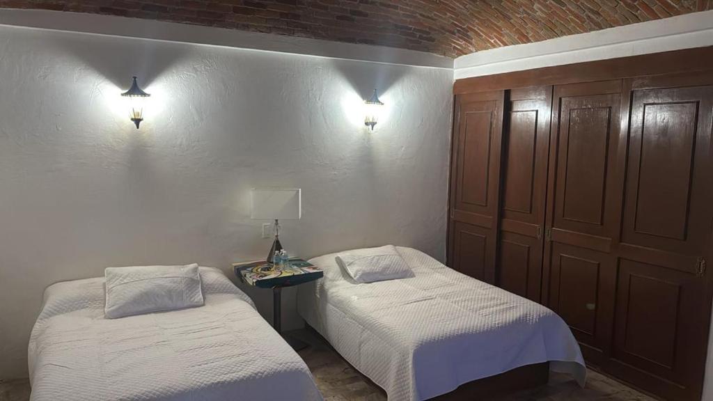 Кровать или кровати в номере Hacienda 21