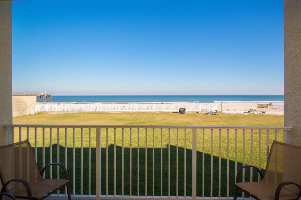 a view of the beach from the balcony of a condo at Pier Point South Oceanfront Townhouse Condo A-8 in Saint Augustine Beach