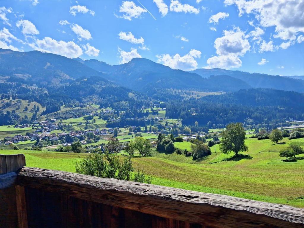 a view of a valley with mountains in the distance at Maso Tre Cucù by Go New Location in Cavalese