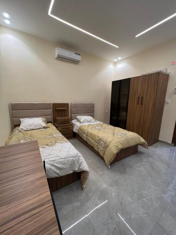 Postel nebo postele na pokoji v ubytování Wadi Rum chalets