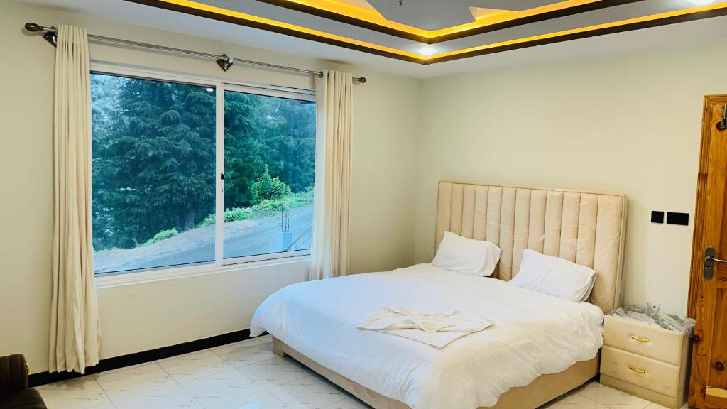 Ένα ή περισσότερα κρεβάτια σε δωμάτιο στο Luxus retreat Nathia gali cantt