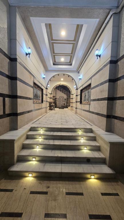 an empty hallway with stairs in a building at Cairo Orginals Hostel in Cairo