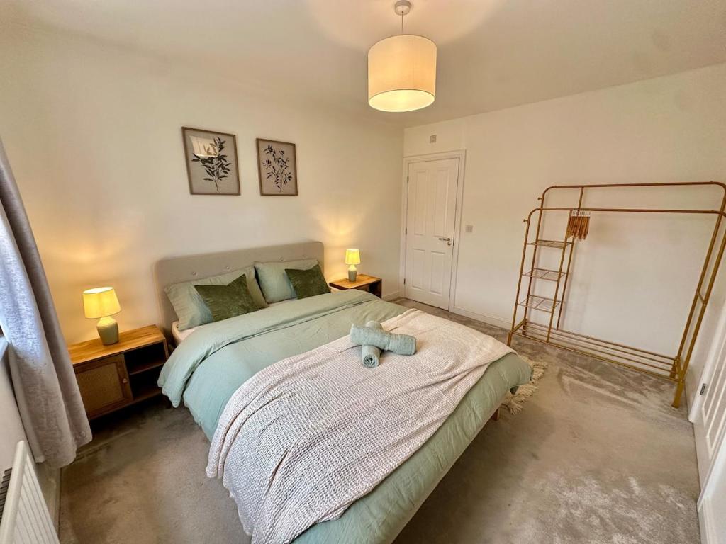 a bedroom with a bed with a blue teddy bear on it at The Nest at Heaton Family Friendly Near Preston and Blackpool Ample Parking and WiFi in Kirkham