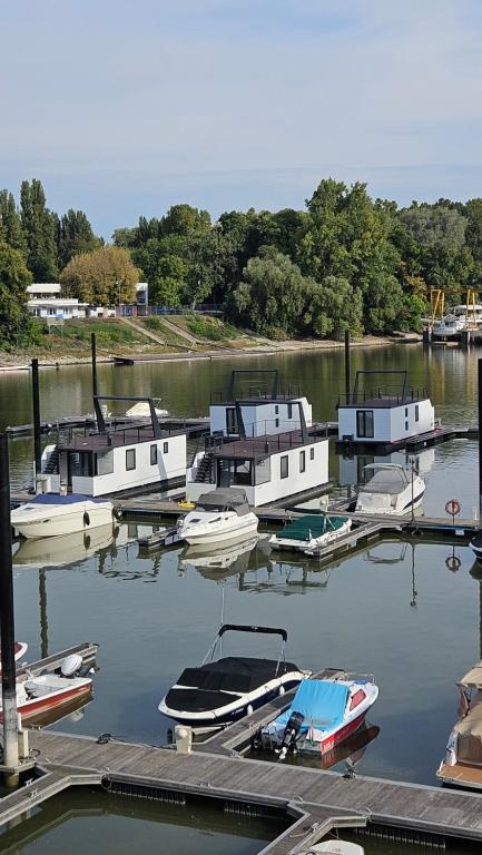 a group of boats are docked in a harbor at Prestige Yacht Resort Budapest in Budapest