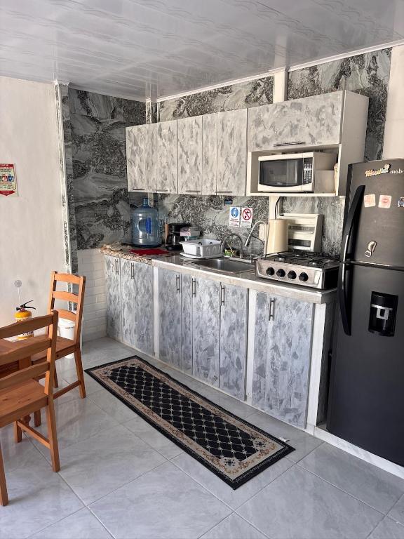 Kuchyň nebo kuchyňský kout v ubytování Salty Ocean Apartament