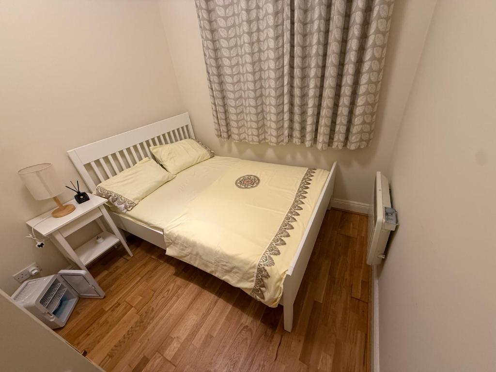 a small bedroom with a bed and a window at Dublin Cozy Room in Ballsbridge - near Grand Canal &Aviva in Dublin