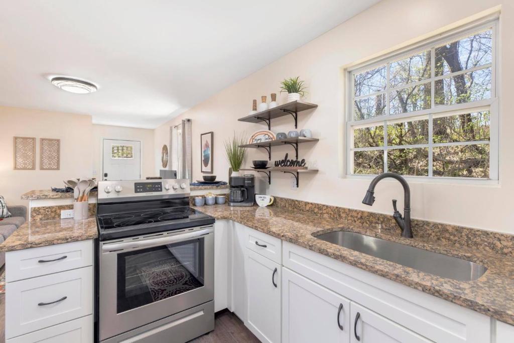 a kitchen with a sink and a stove at Renovated 2BR *Central Location* in Johnson City