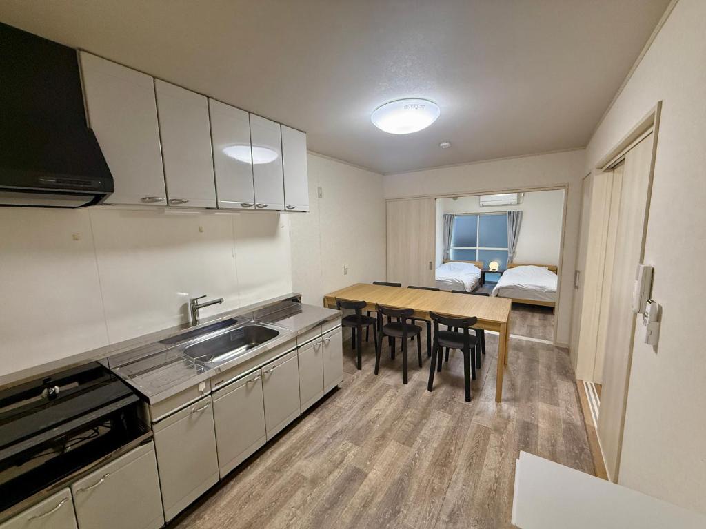 Kuchyň nebo kuchyňský kout v ubytování Satsuki Apartment Hotel - Koguchi Area