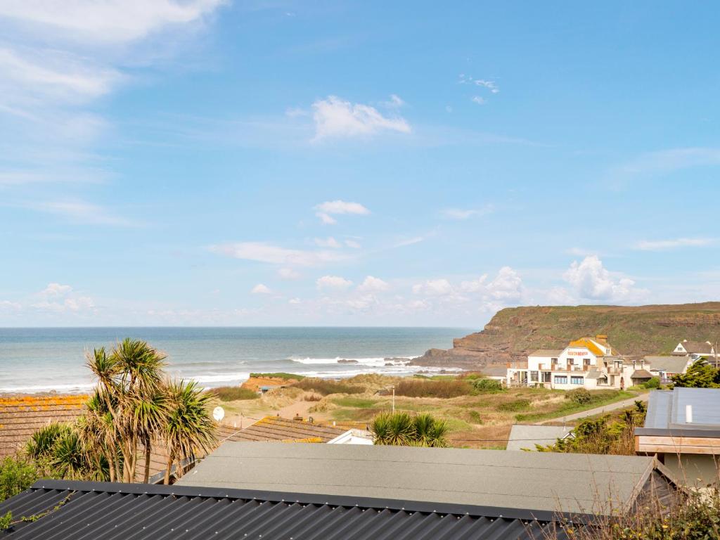 a view of the ocean from the roof of a house at Bellair in Marhamchurch