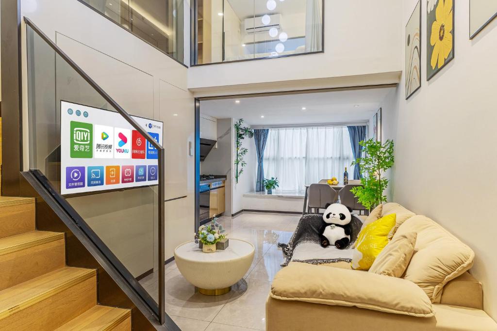 TV a/nebo společenská místnost v ubytování Duoya International Apartment