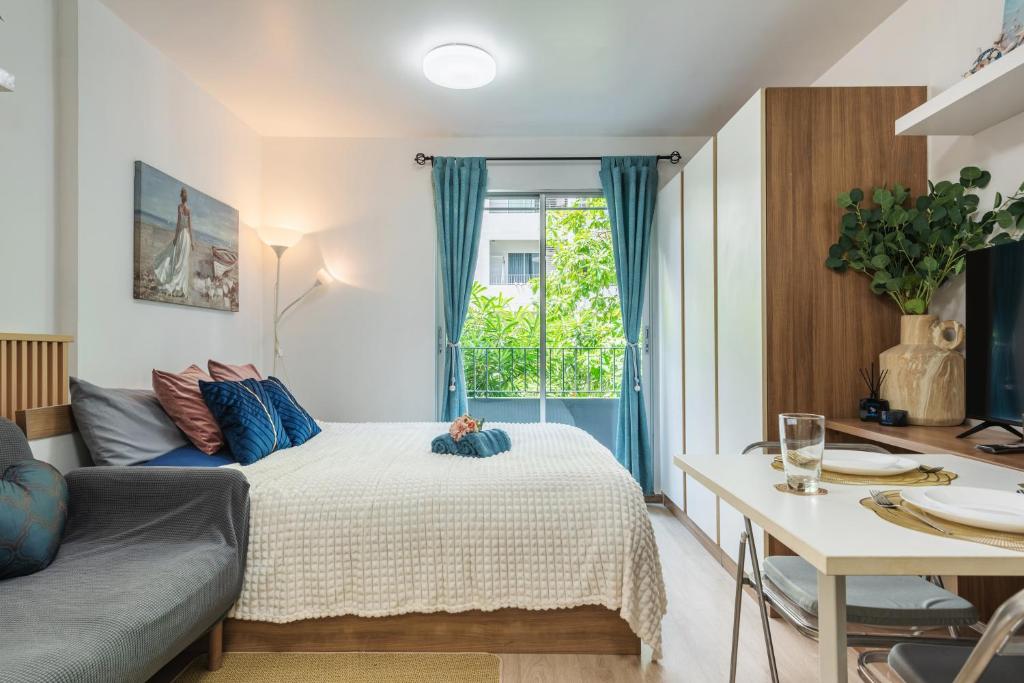 En eller flere senge i et værelse på Elio Sukhumvit 64 BTS Punnawithi