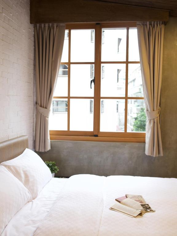 Postel nebo postele na pokoji v ubytování Jian Shan Hotel