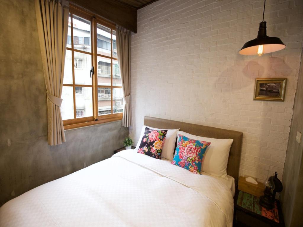 Postel nebo postele na pokoji v ubytování Jian Shan Hotel