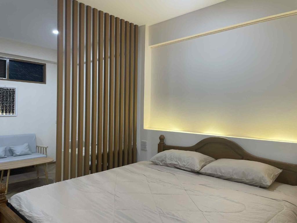 Giường trong phòng chung tại Dime Rama III