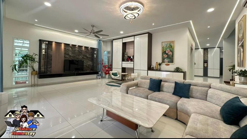 a living room with a couch and a table at 3KM to UTAR Sungai Long Party House 45Pax 20Car in Kajang