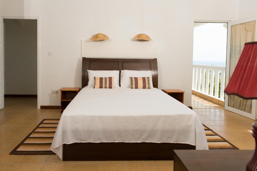 Postel nebo postele na pokoji v ubytování Villa Kayola - Self Catering