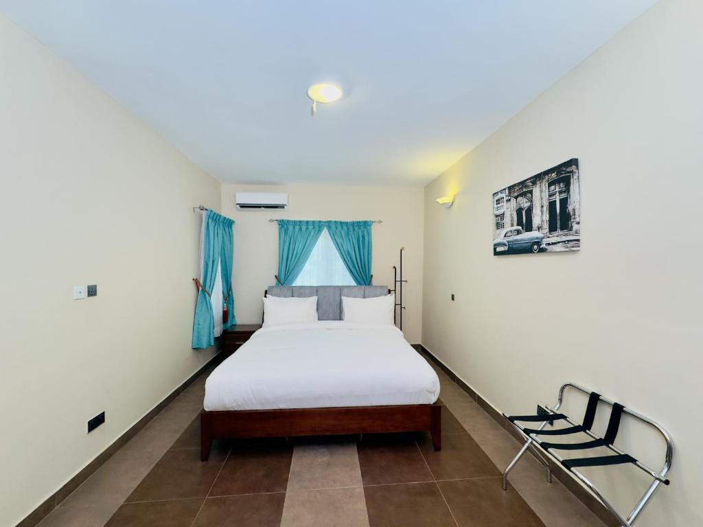 Ένα ή περισσότερα κρεβάτια σε δωμάτιο στο Hayat Apartments & Homes