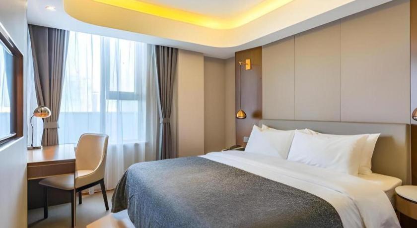 Postel nebo postele na pokoji v ubytování Yitel Collection Beijing Capital Airport New International Exhibition