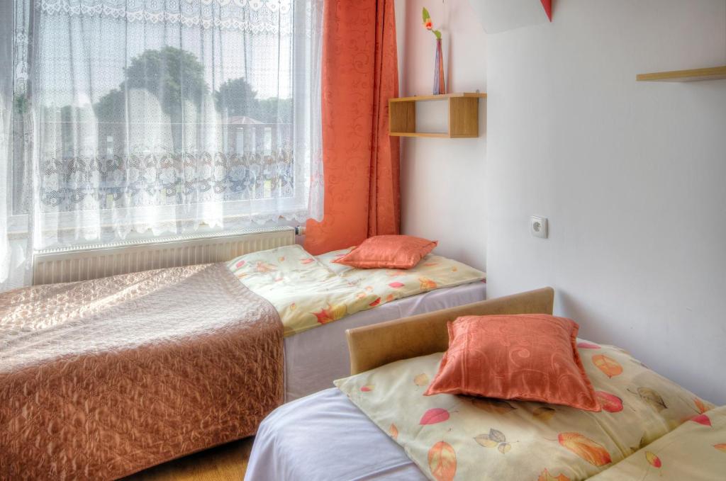 Postel nebo postele na pokoji v ubytování Zibi i Pod Topolami