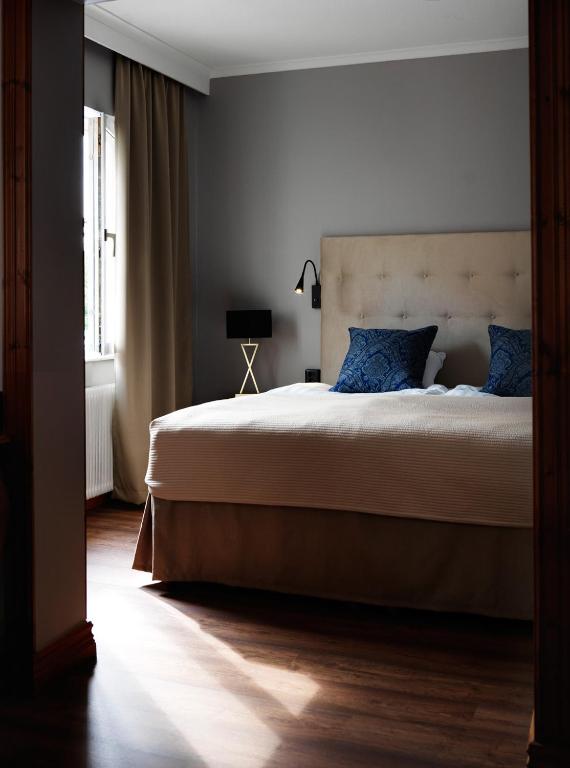 Postel nebo postele na pokoji v ubytování Home Hotel Smedjan