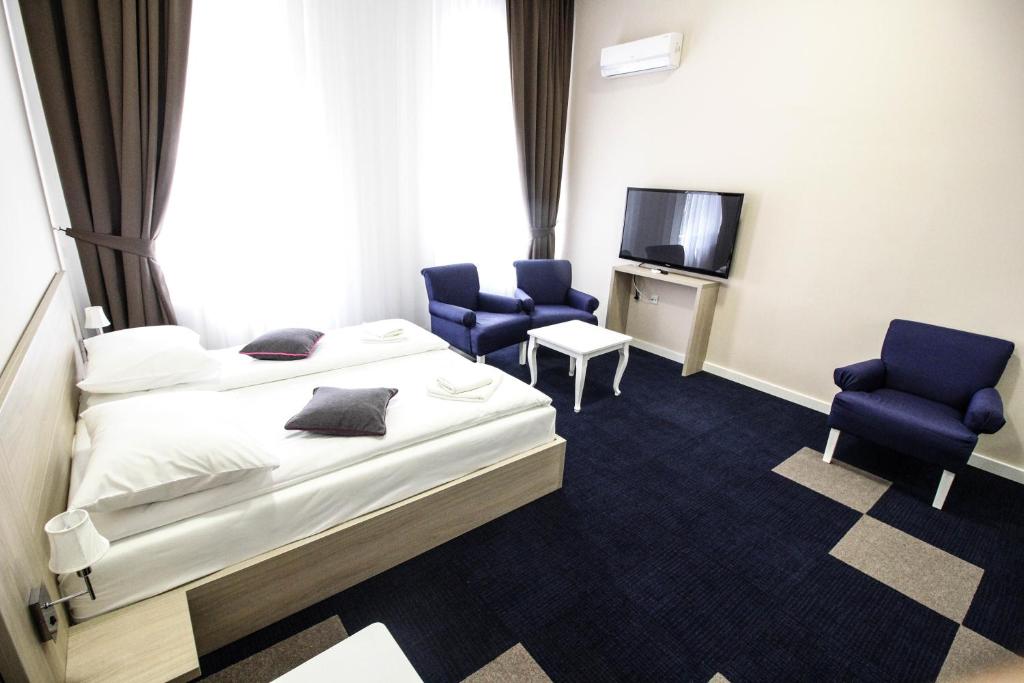 Postel nebo postele na pokoji v ubytování Hotel Story