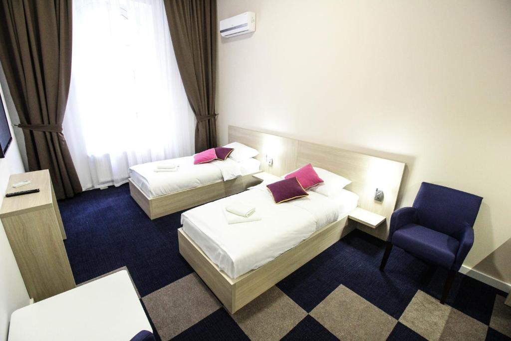 Postel nebo postele na pokoji v ubytování Hotel Story