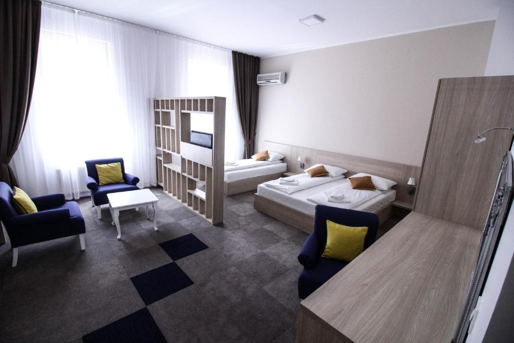 Postel nebo postele na pokoji v ubytování Hotel Story
