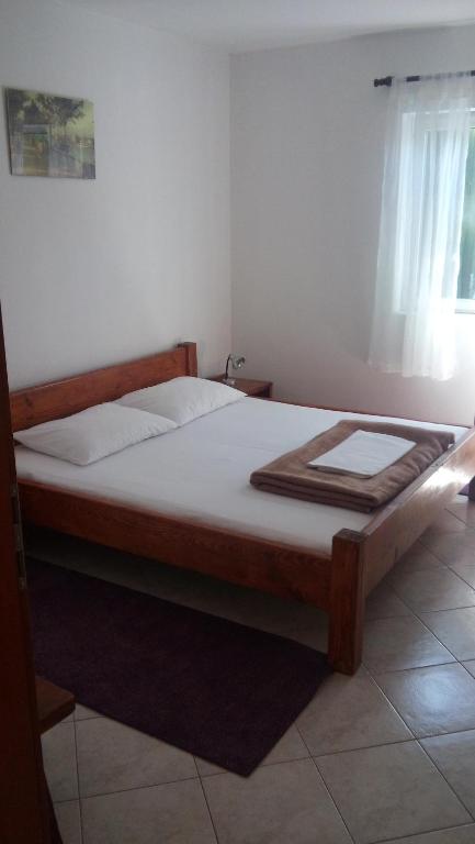 Postel nebo postele na pokoji v ubytování Apartments Matulic