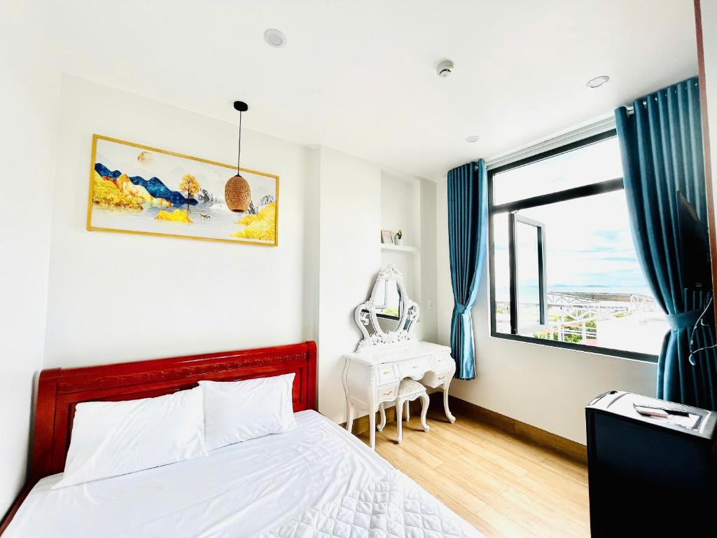 Ένα ή περισσότερα κρεβάτια σε δωμάτιο στο Homestay Lumia Gold