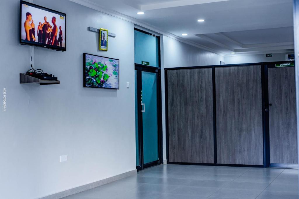 an elevator with a sliding door in a room at Stay simple lodge in Lusaka