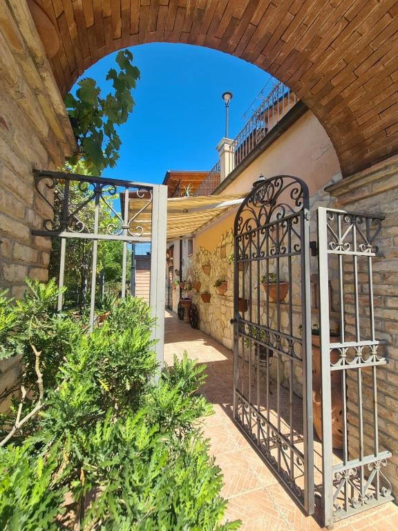 an entrance to a building with an iron gate at Residenza Magister in Serramonacesca