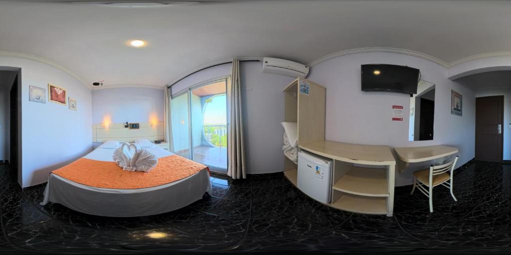 Ένα ή περισσότερα κρεβάτια σε δωμάτιο στο Hotel Três Fronteiras
