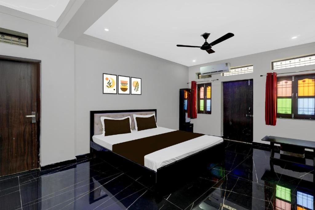a bedroom with a bed and a desk at Grandview mansion & Daulat villas in Udaipur