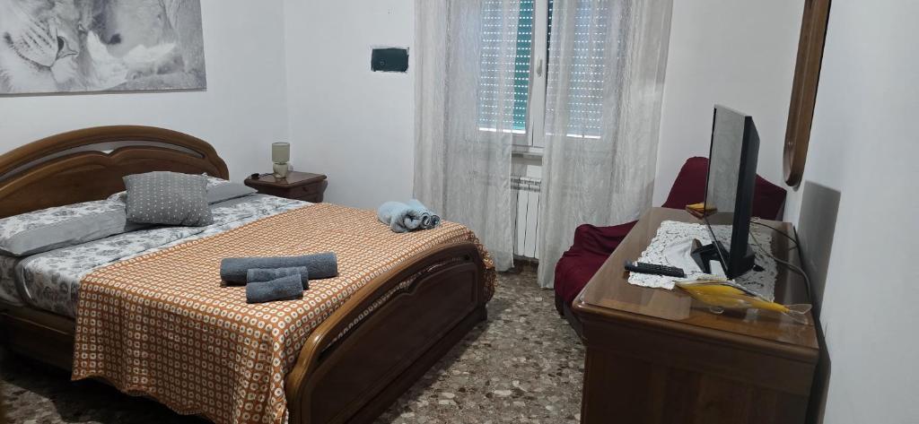 Ένα ή περισσότερα κρεβάτια σε δωμάτιο στο Le FARFALLE