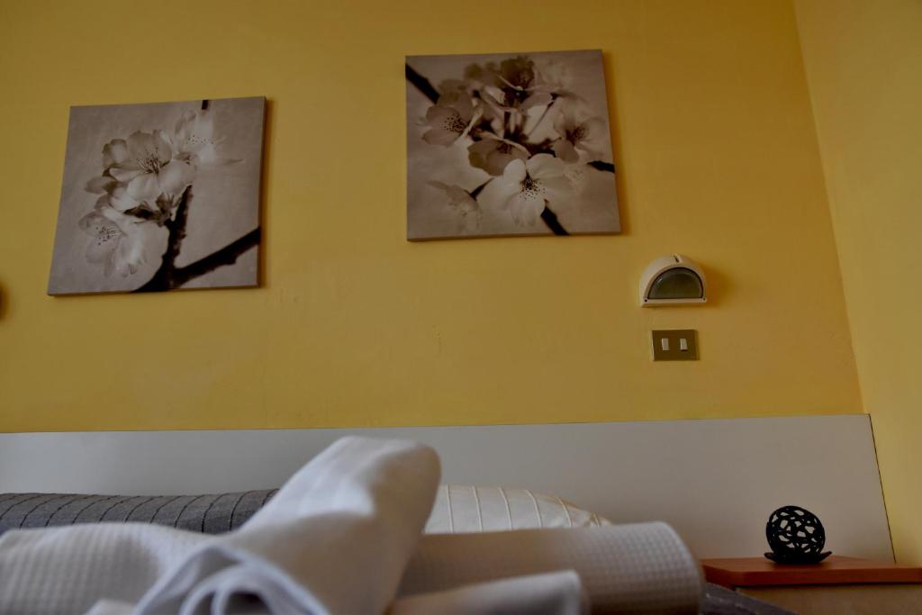 Postel nebo postele na pokoji v ubytování Hotel Graziella
