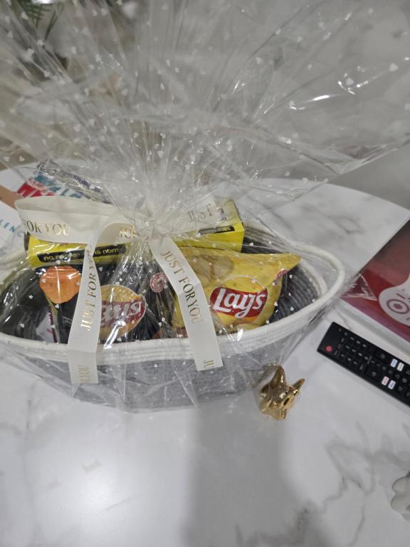 a package of chips and snacks in a plastic bag at Cozy Modern Spacious 2 Bedroom and full kitchen in Southwest Calgary in Calgary